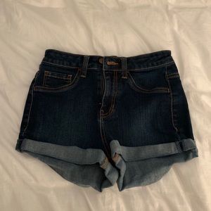 Dark blue jean shorts.